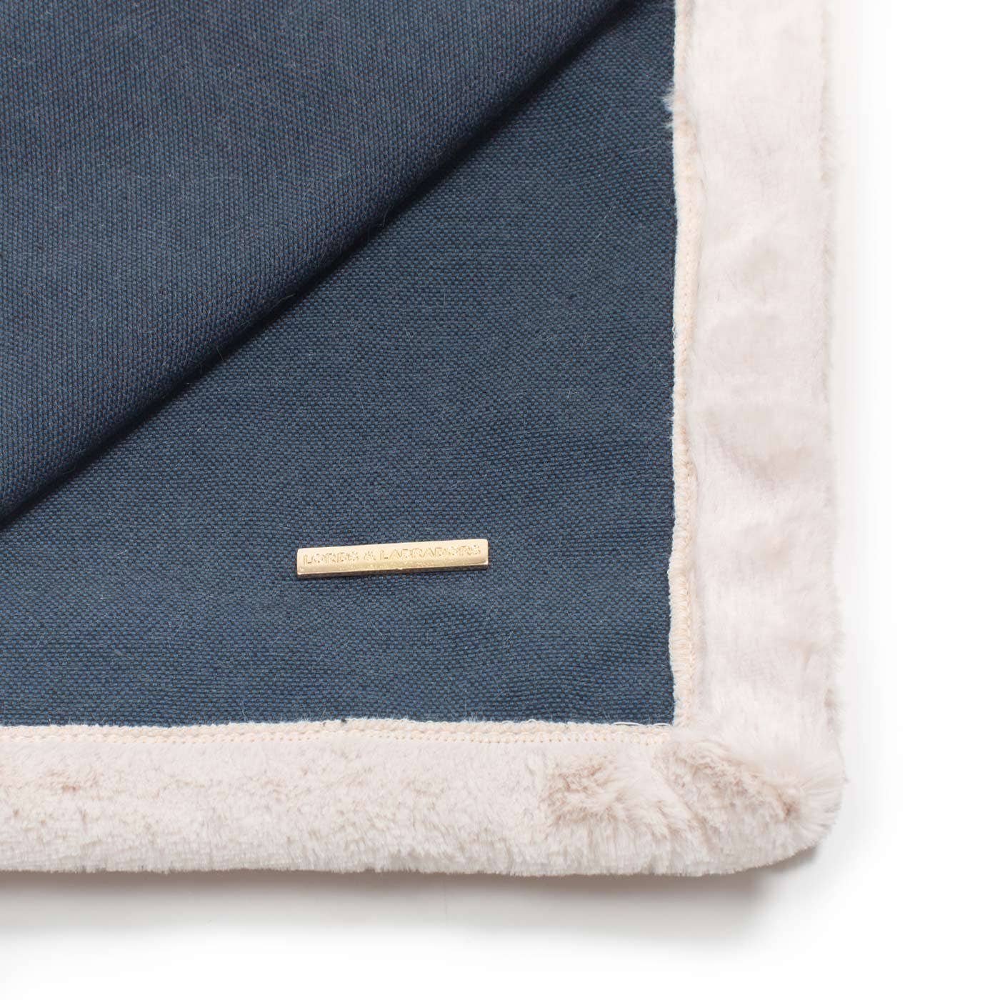 Gold L&L plaque detail on the Essentials Twill Blanket in Denim