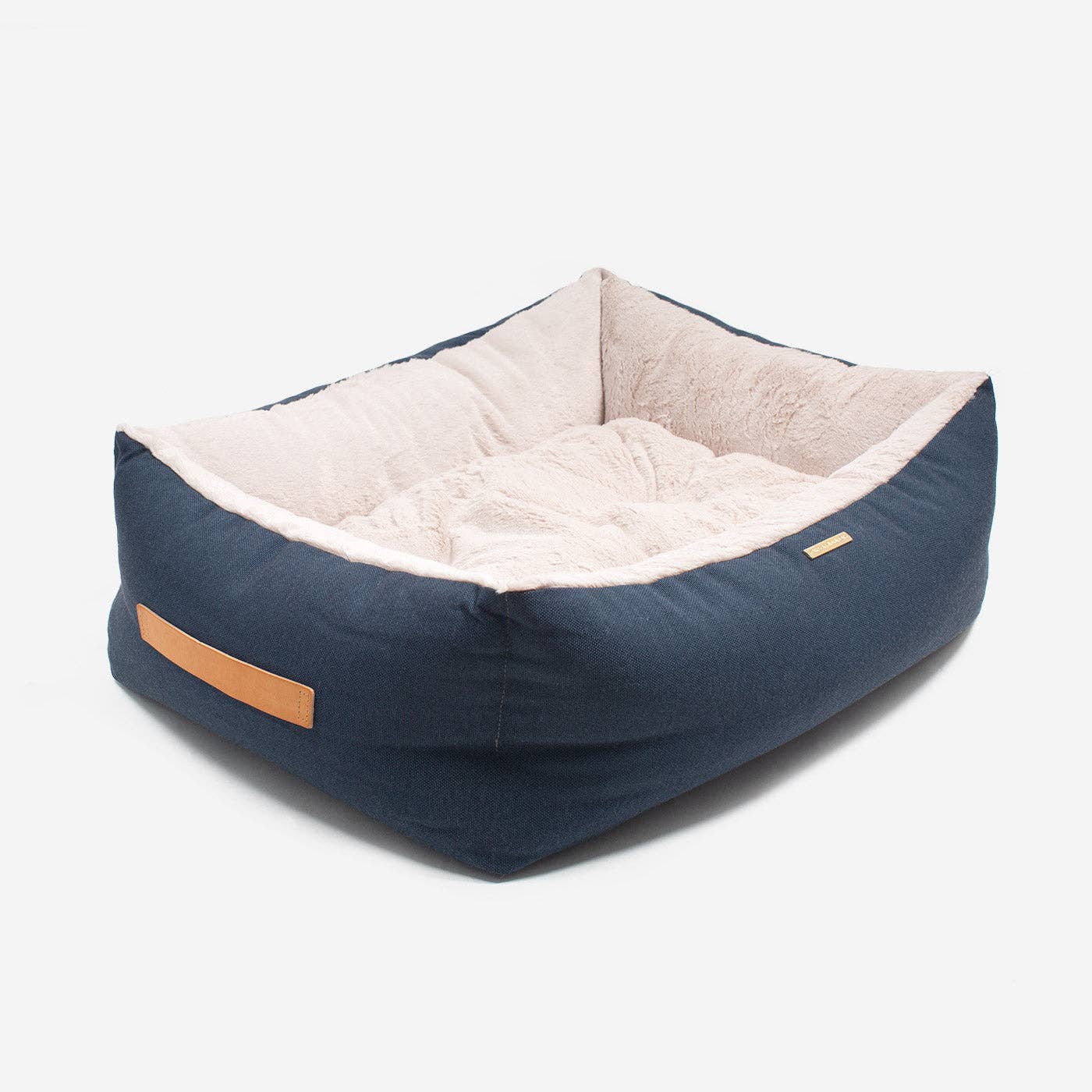 Dog relaxing inside the Essentials Twill Box Bed in Denim