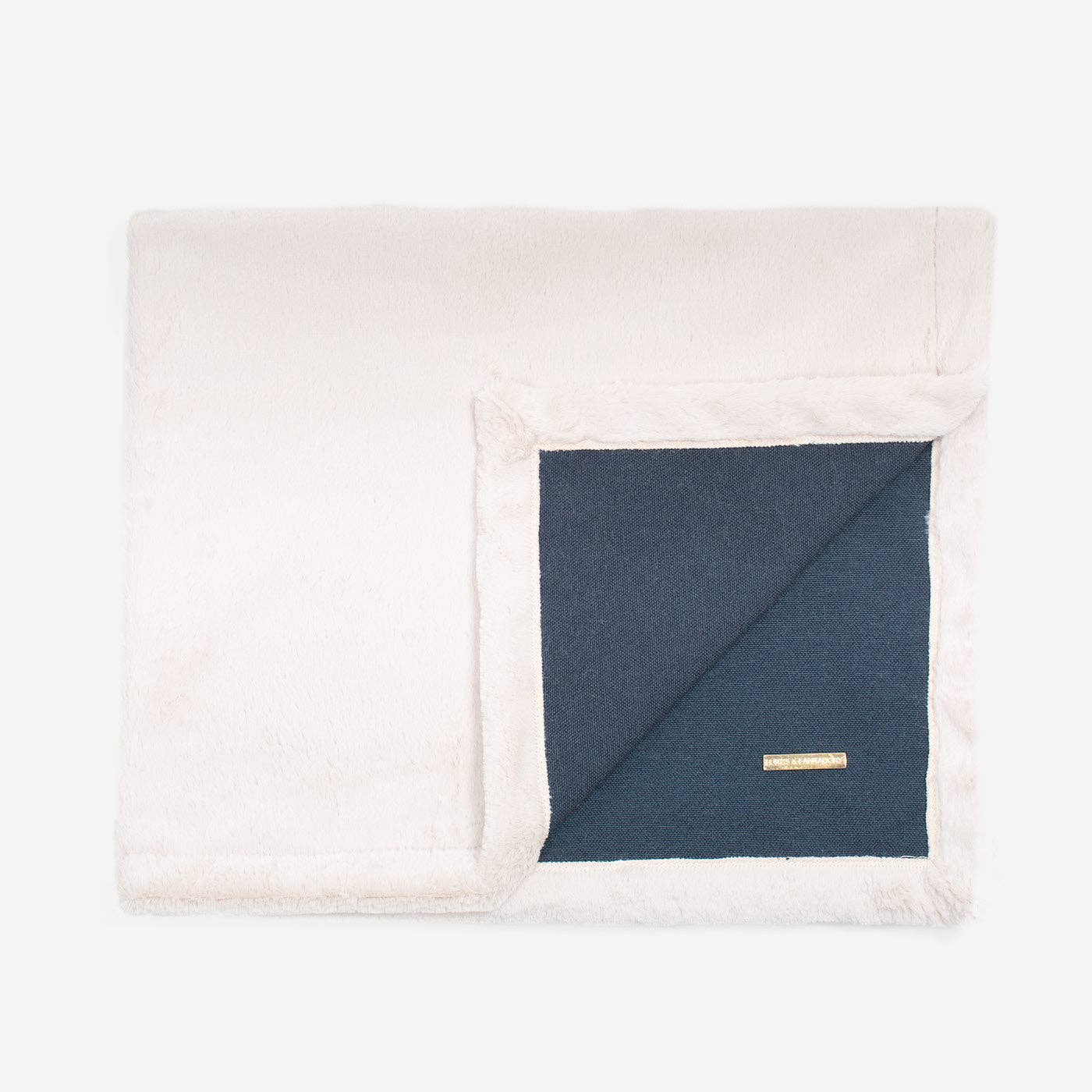 Folded Essentials Twill Blanket in Denim showing plush texture