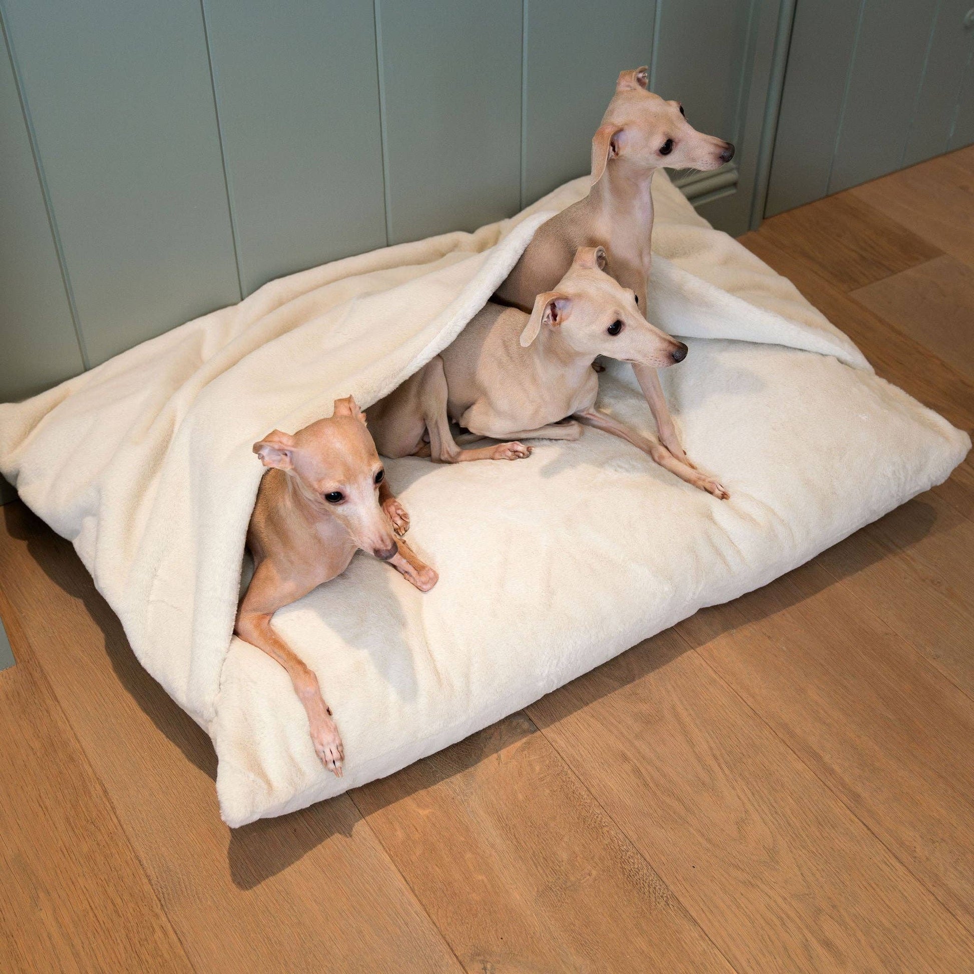 Hooded burrow design on the Cream Faux Fur Sleepy Burrows Bed