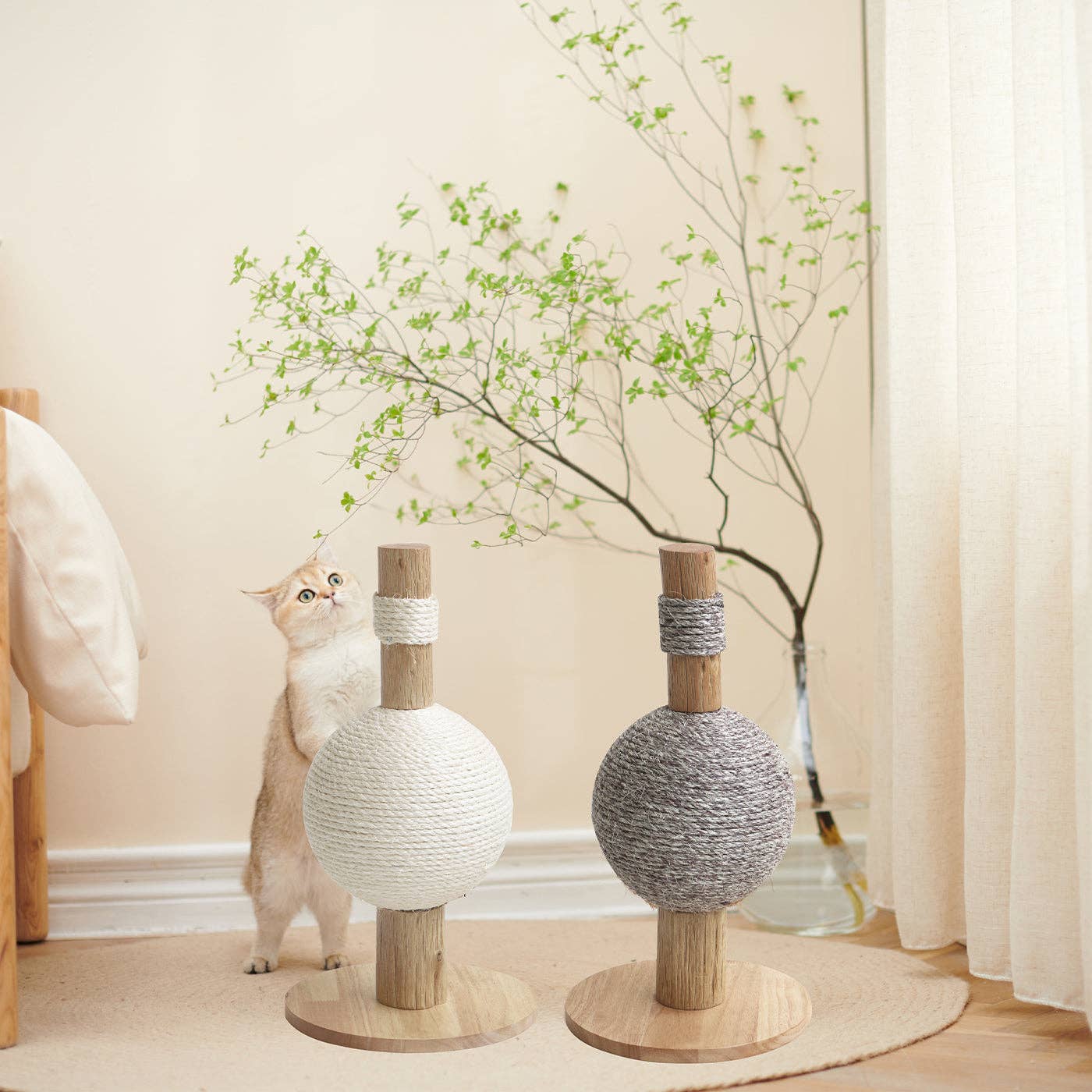 Cat using the Helsinki The Ball Cat Scratch Post in Ivory