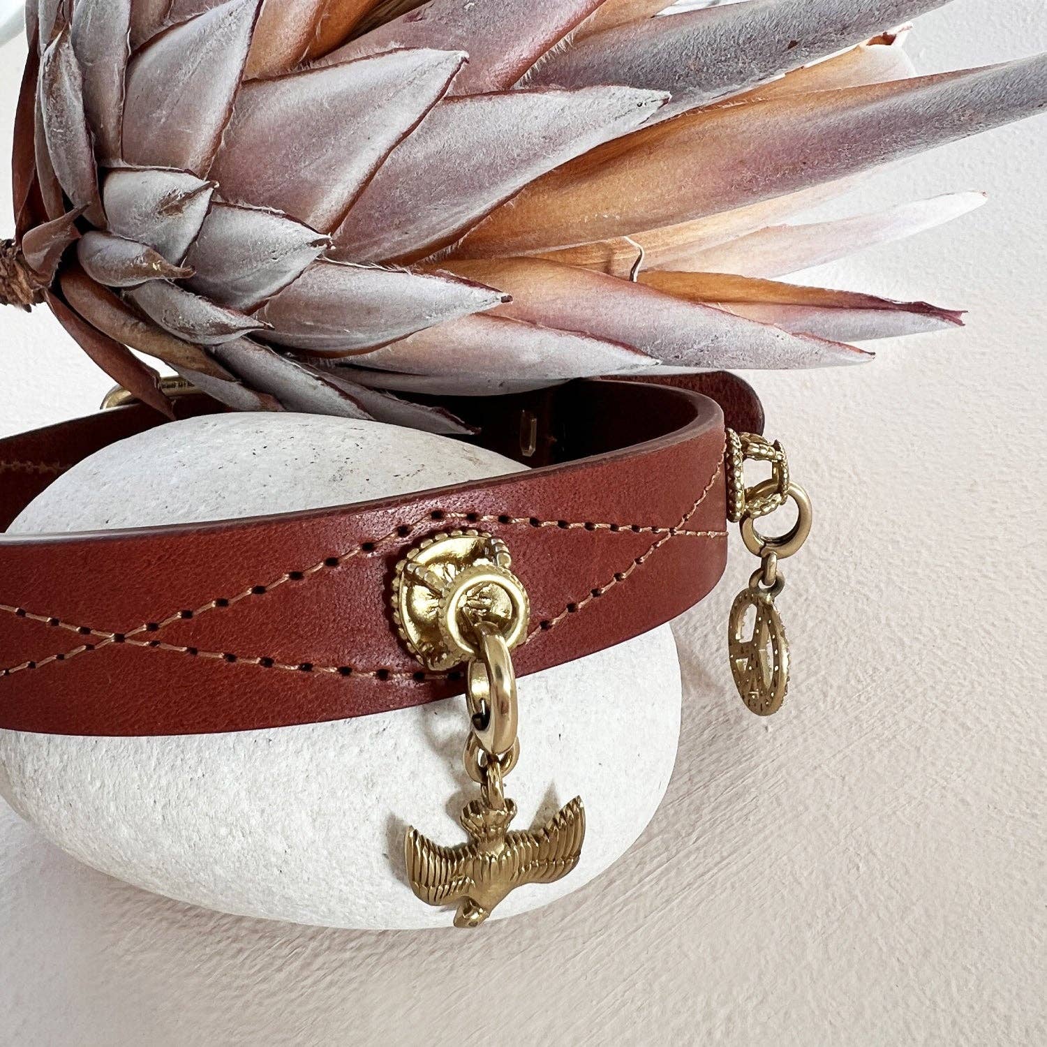 Symbolic bird charm designed for dogs and owners