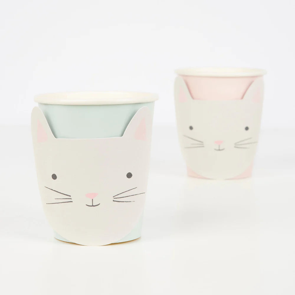 Two cat-shaped ceramic cups on a white background