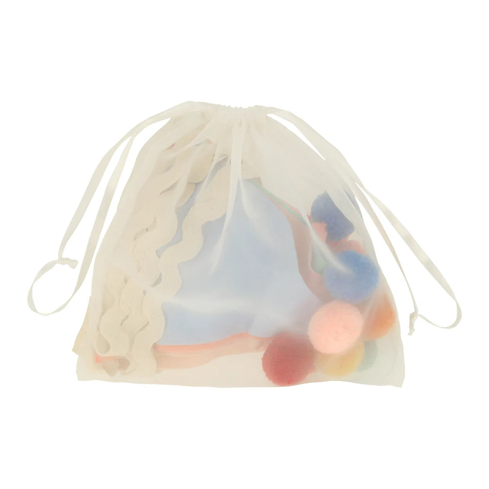 Drawstring bag with colorful items inside on a white background