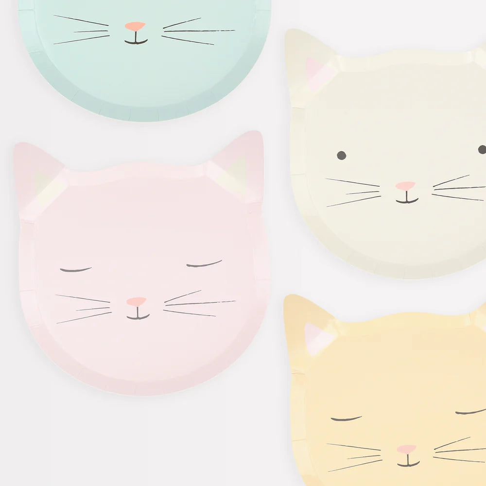 Four pastel-colored cat faces on a white background