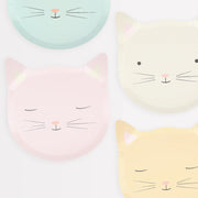Four pastel-colored cat faces on a white background