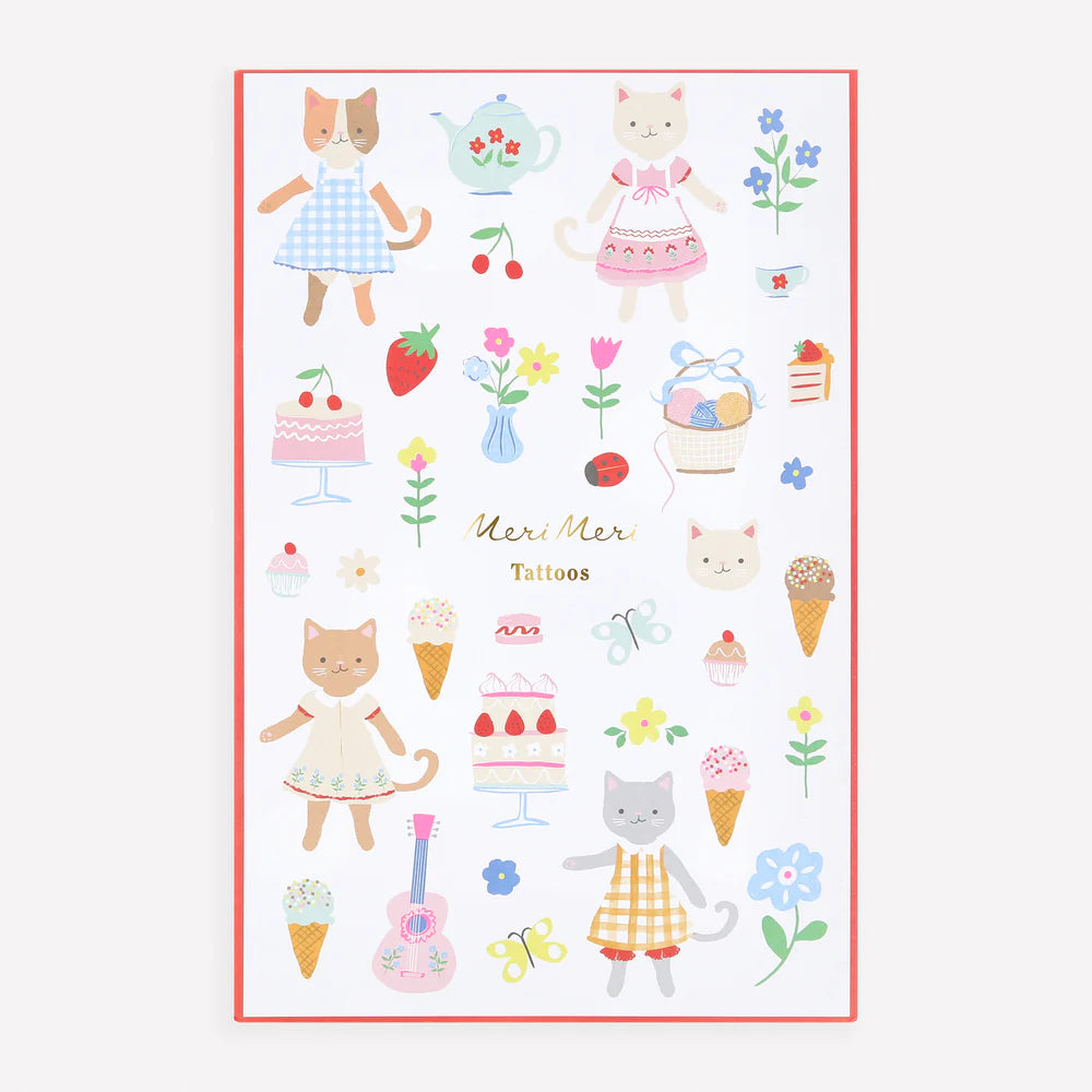 Sheet of temporary tattoos with cat-themed designs on a white background