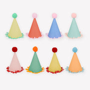 Set of colorful party hats with pom-pom tops on a white background
