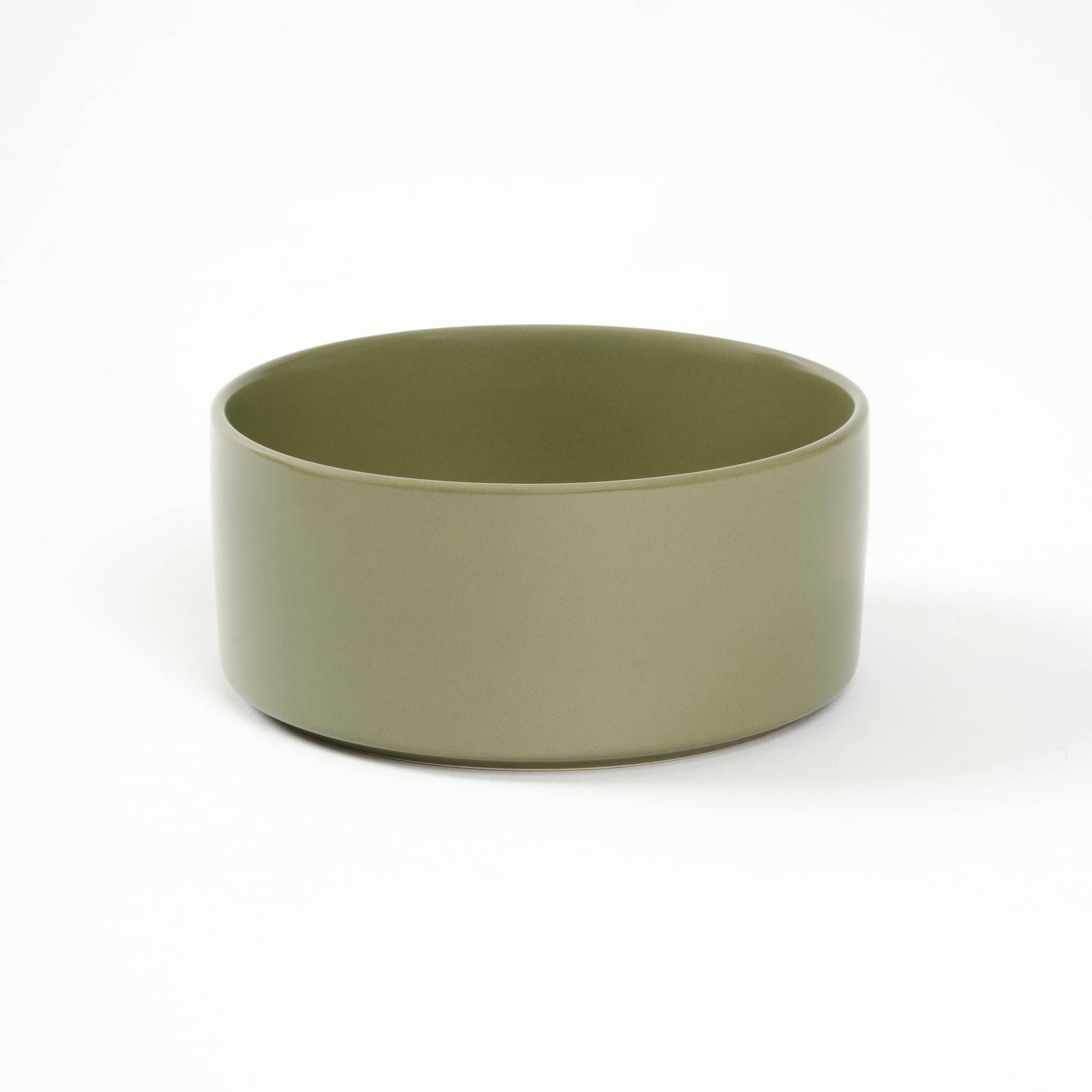 Green ceramic bowl on a white background
