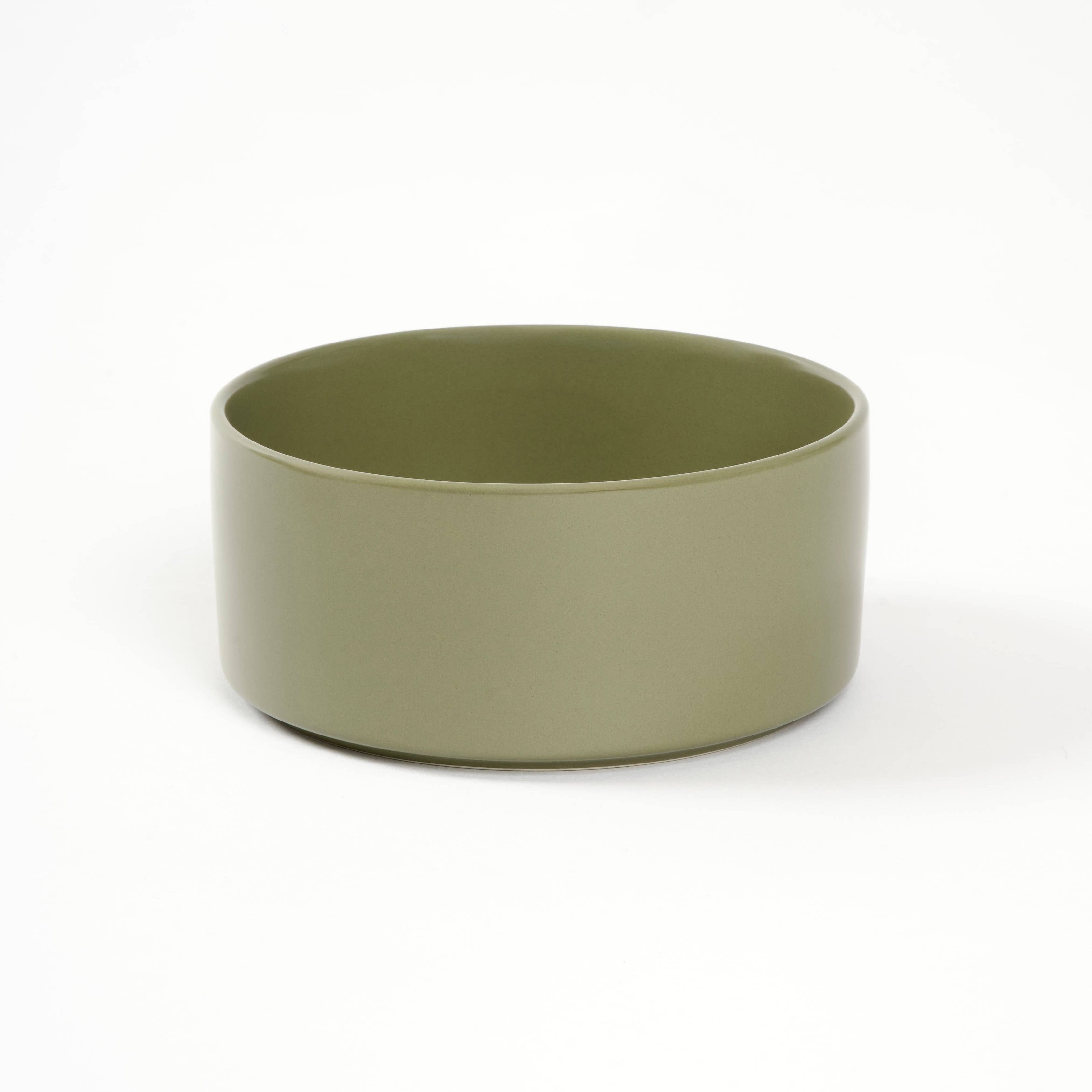 Green ceramic bowl on a white background