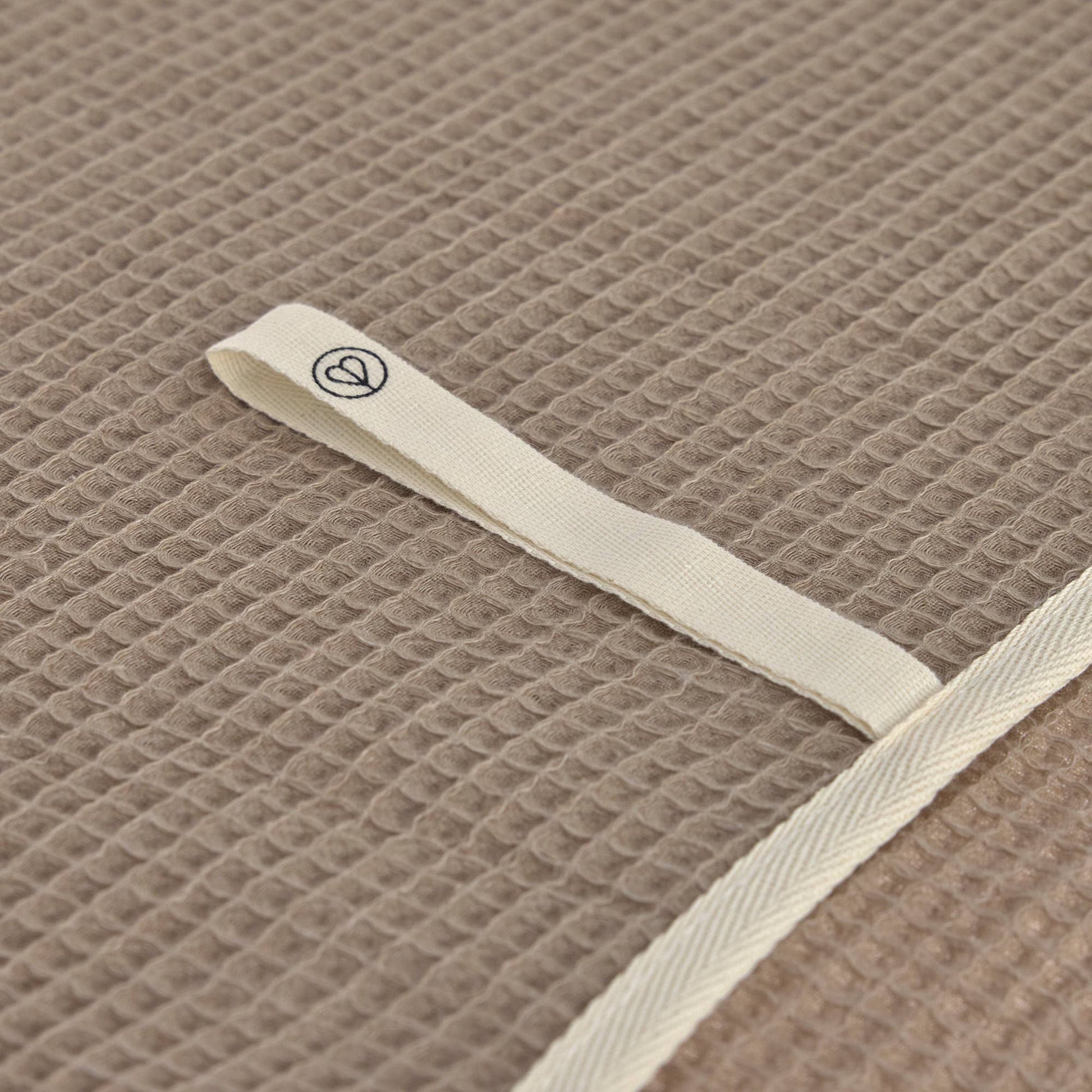 Close up of waffle textured dog towel made from cotton and recycled polyester