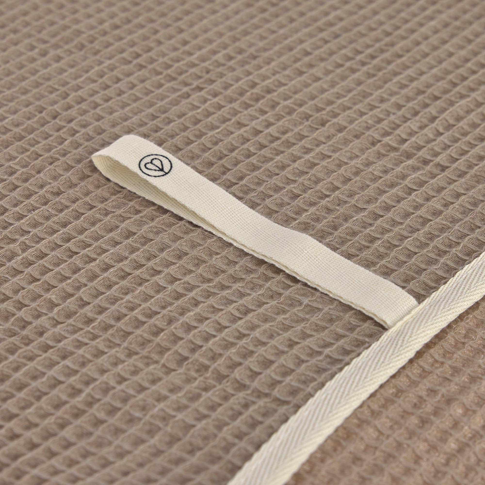 Close up of waffle textured dog towel made from cotton and recycled polyester