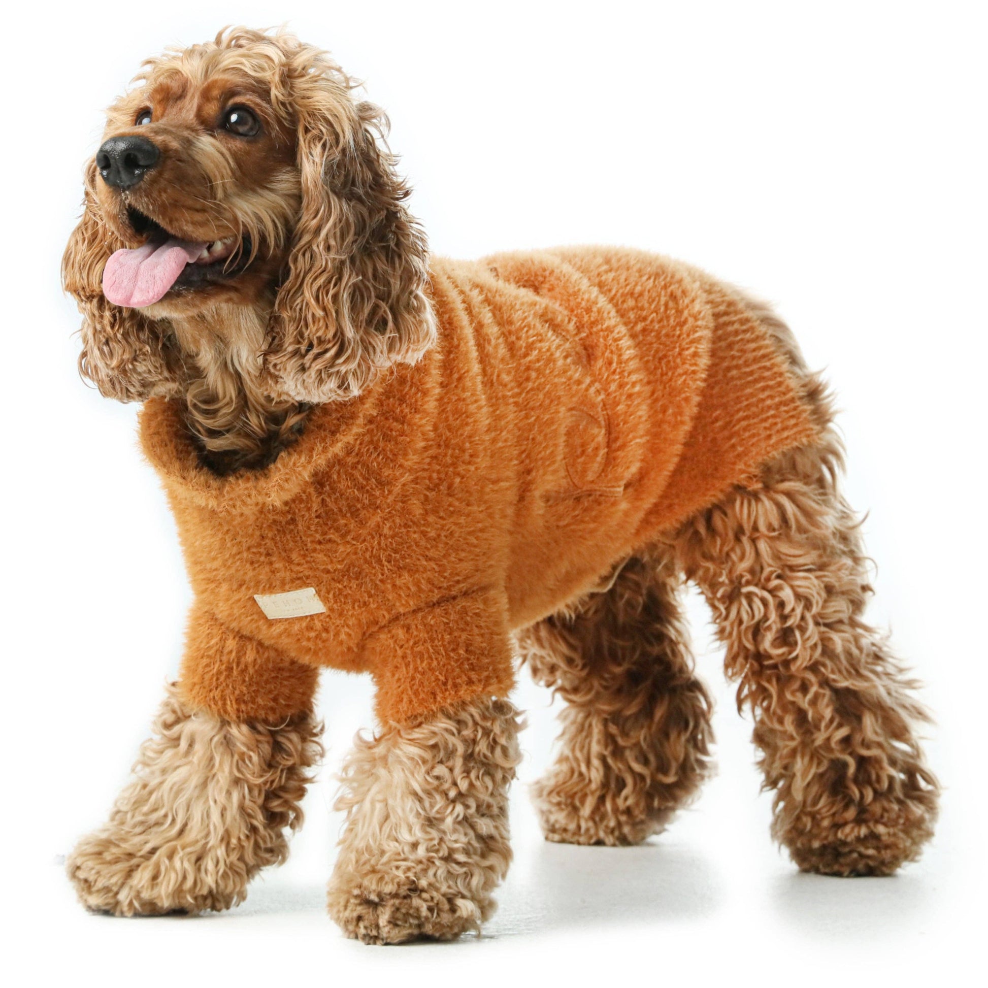 Dog wearing the Eskimo Fuzzy Sweater in Orange