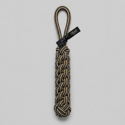 Nylon dog rope toy with a black tag on a light gray background