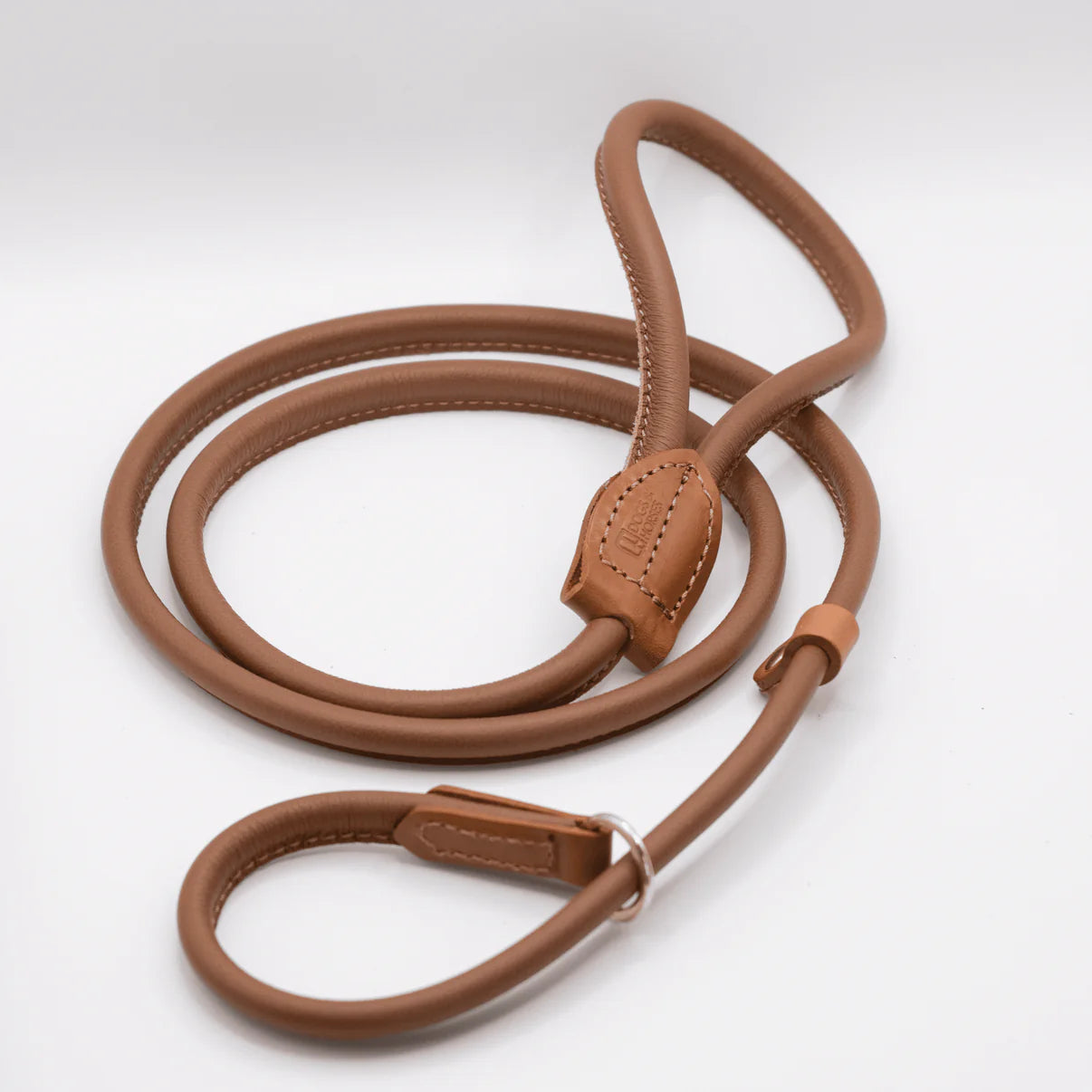 Brown leather dog leash on a white background