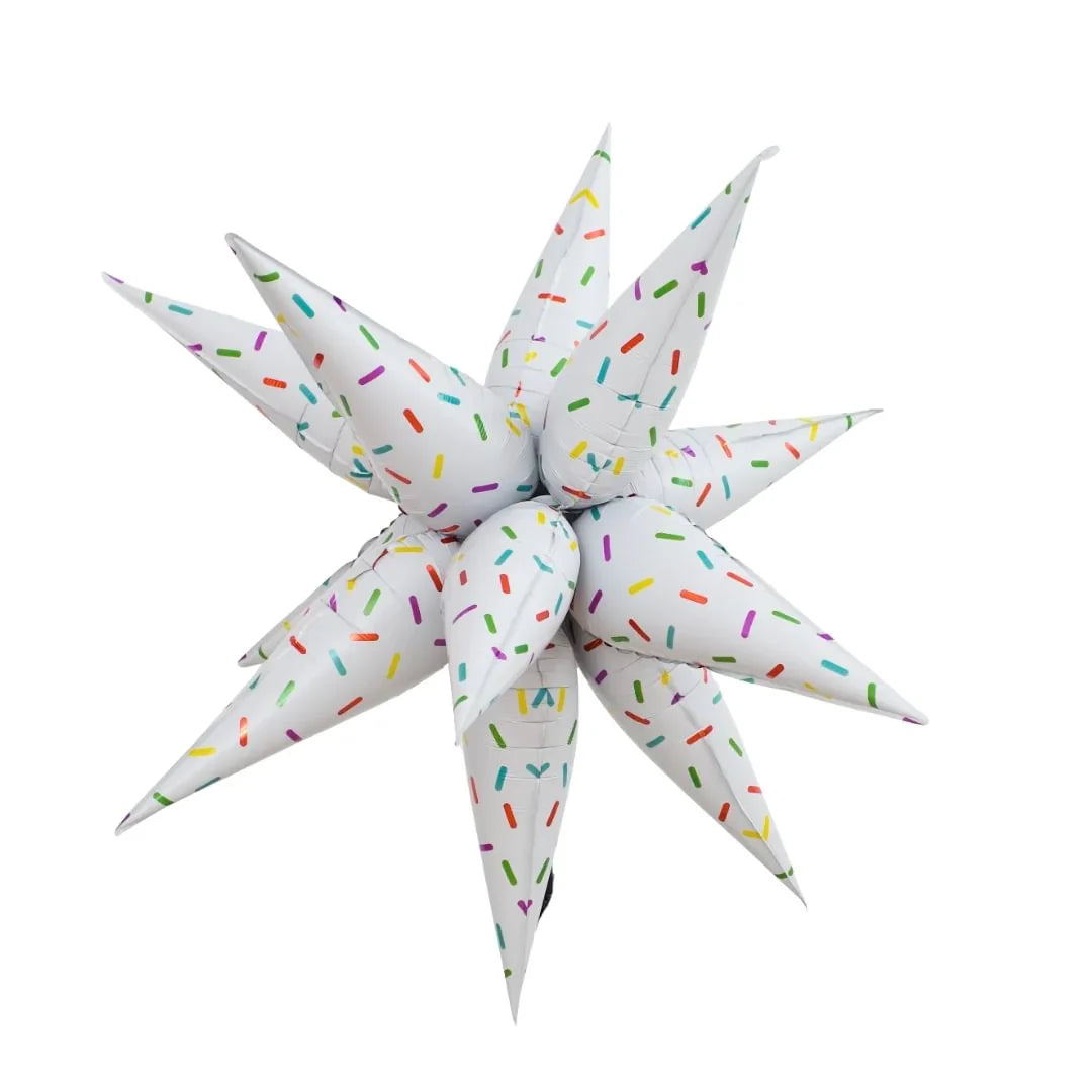 Star-shaped pillow with colorful sprinkles on a white background