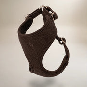 Brown dog harness on a light gray background