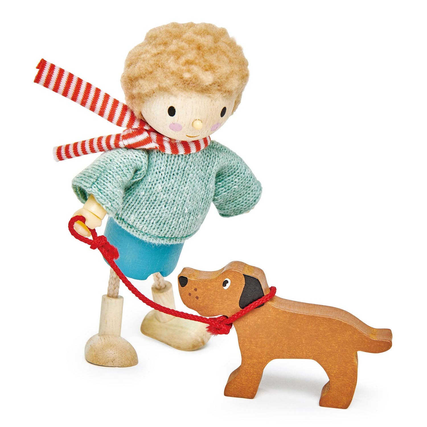 Wooden toy figure of a child with a dog on a white background