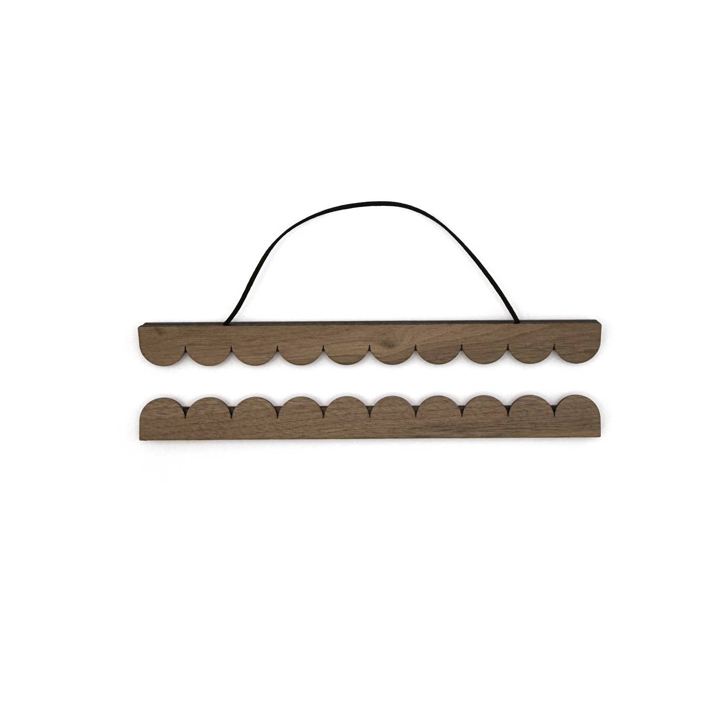 Wooden wall hook with scalloped edge on a white background
